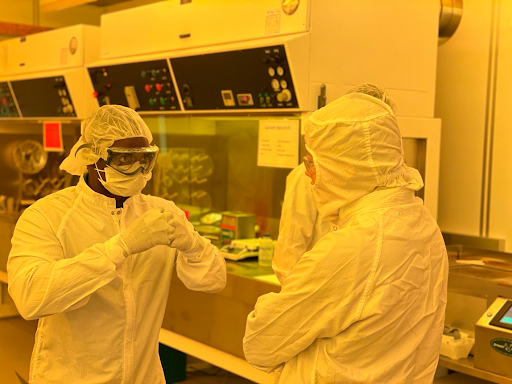 two workers in cleanroom training 