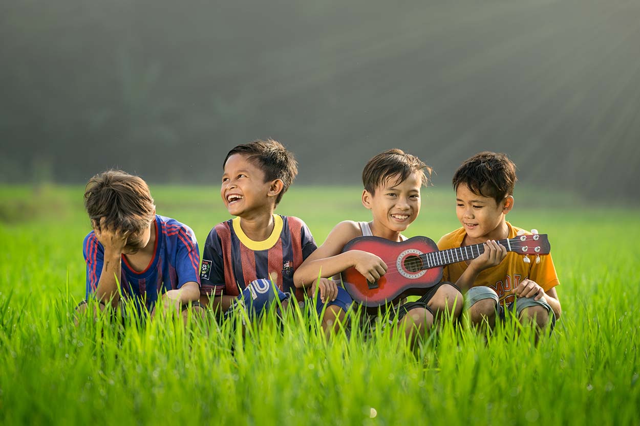 children in the grass