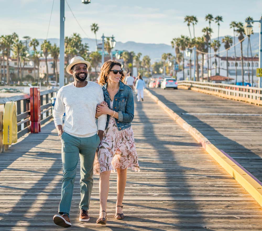 young couple walking on Santa Barbara pier